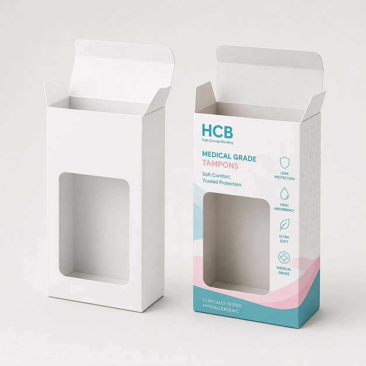 Two boxes with circular window cutouts, one plain and one printed with teal floral patterns. class=